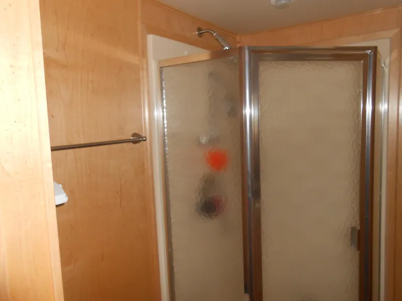 Slide: The Image of Shower area in 2008 Sumerset 7518 houseboat with frosted glass door. - 9