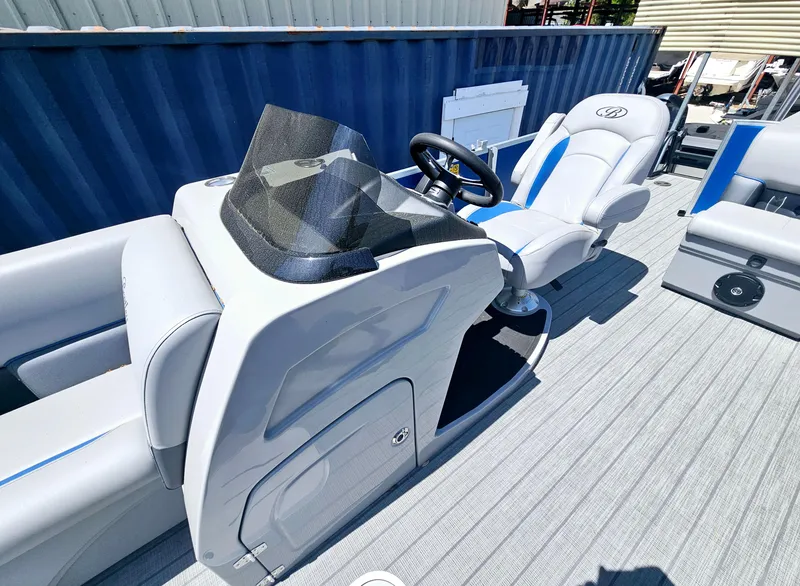 Slide: The Image of 2025 Bentley Pontoons Legacy Cruise 223 interior with sleek helm and comfortable seating. - 12