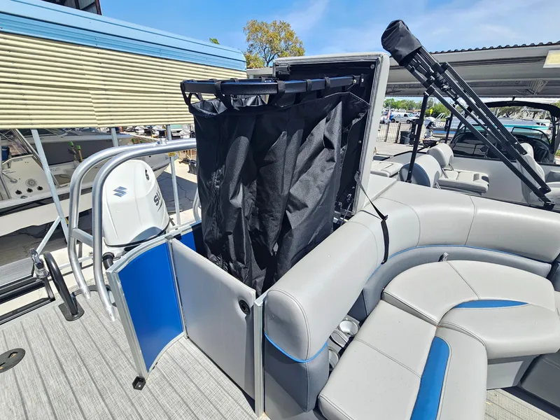 Slide: The Image of 2025 Bentley Pontoons Legacy Cruise 223 interior with seating and storage area. - 17