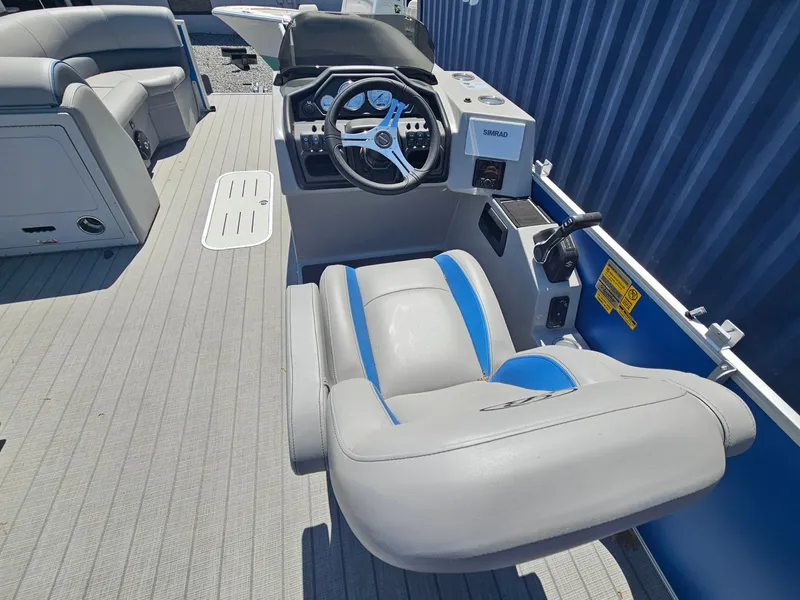 Slide: The Image of 2025 Bentley Pontoons Legacy Cruise 223 interior with steering wheel and seating. - 19