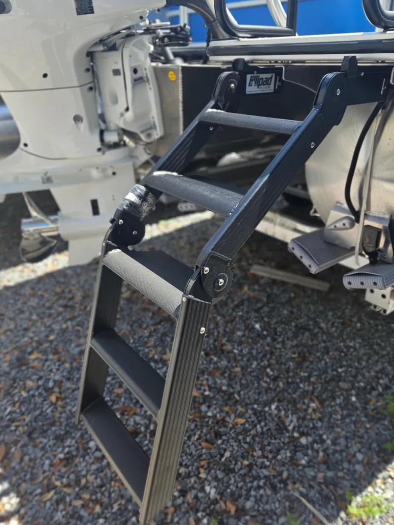 Slide: The Image of 2025 Bentley Pontoons Legacy Cruise 223 with a foldable boarding ladder. - 24