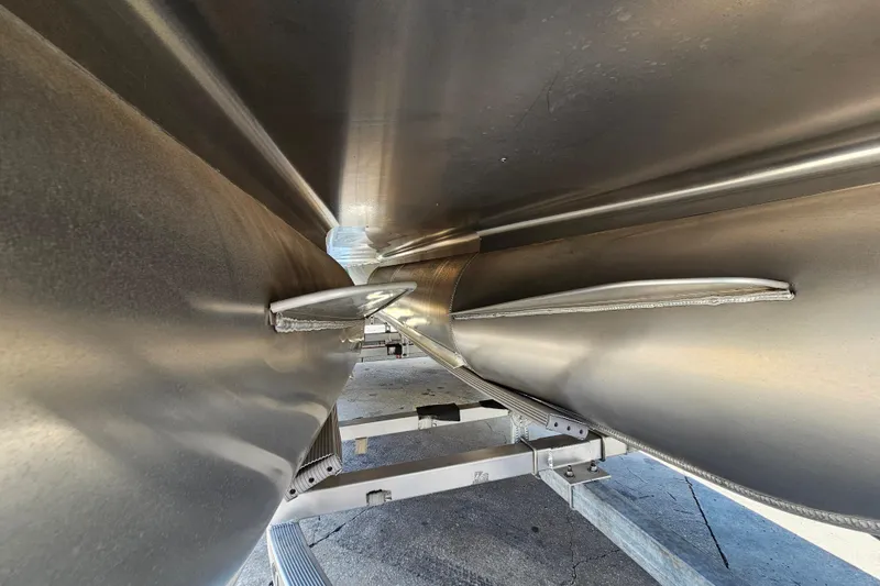 Slide: The Image of 2025 Bentley Pontoons Legacy Cruise 223 undercarriage view, showcasing sleek aluminum pontoons. - 25