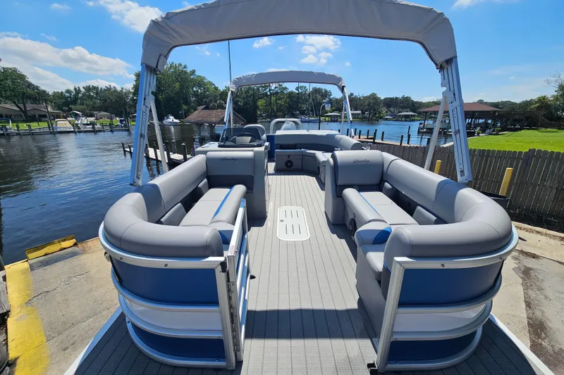 Slide: The Image of 2025 Bentley Pontoons Legacy Cruise 223 on a sunny waterfront dock. - 3