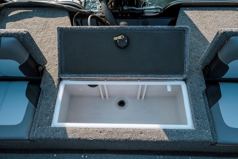 Slide: The Image of 2025 Crestliner 1650 Hawk SC J boat with open storage compartment. - 3