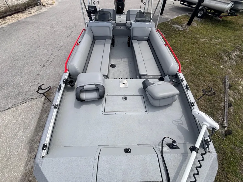 Slide: The Image of 2019 SeaArk Big Easy boat with spacious seating and red railings, viewed from above. - 26