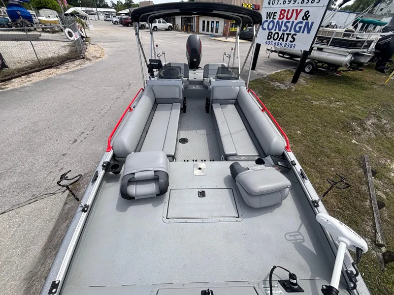 Slide: The Image of 2019 SeaArk Big Easy boat with spacious seating and fishing rod holders. - 27