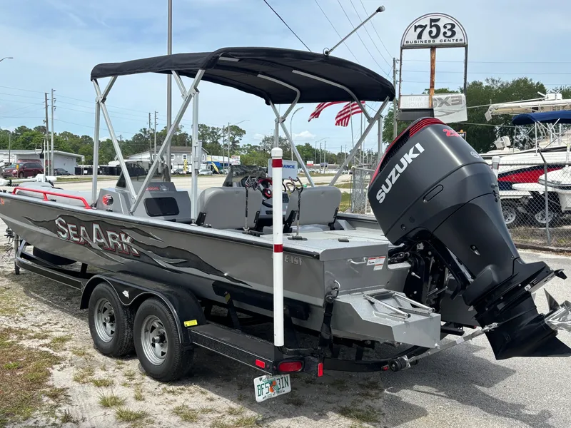Slide: The Image of 2019 SeaArk Big Easy boat with Suzuki outboard motor on a trailer. - 5