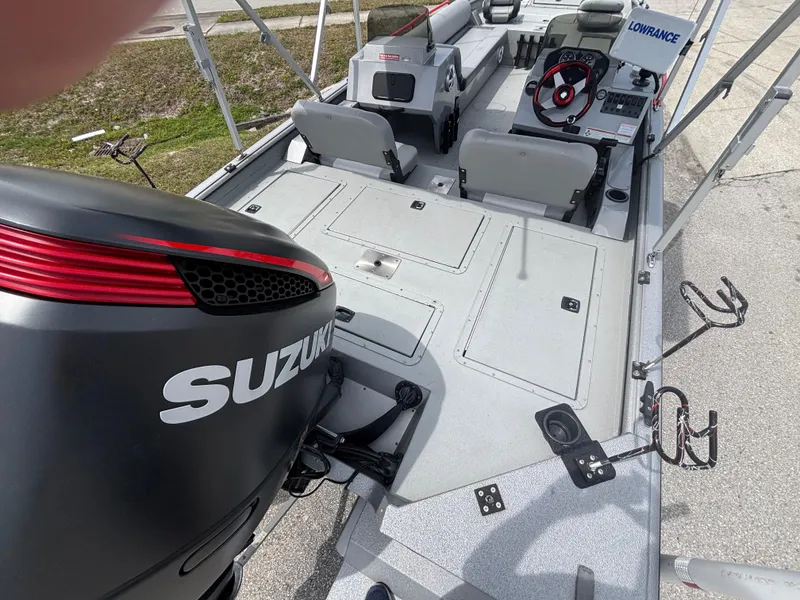 Slide: The Image of 2019 SeaArk Big Easy boat interior with Suzuki engine and Lowrance equipment. - 9