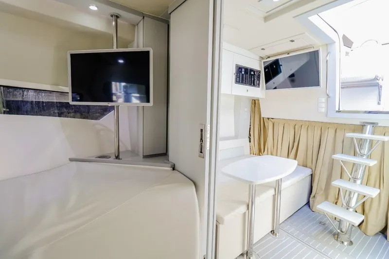 Slide: The Image of Luxurious interior of 2021 Evolve 400HT yacht with TV, seating, and modern design. - 13