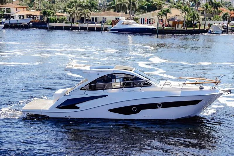Slide: The Image of 2021 Evolve 400HT yacht cruising on a sunny waterfront. - 3