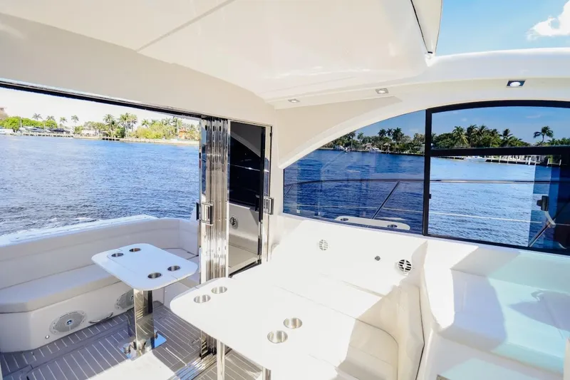 Slide: The Image of Luxurious 2021 Evolve 400HT yacht interior with scenic waterfront view. - 7