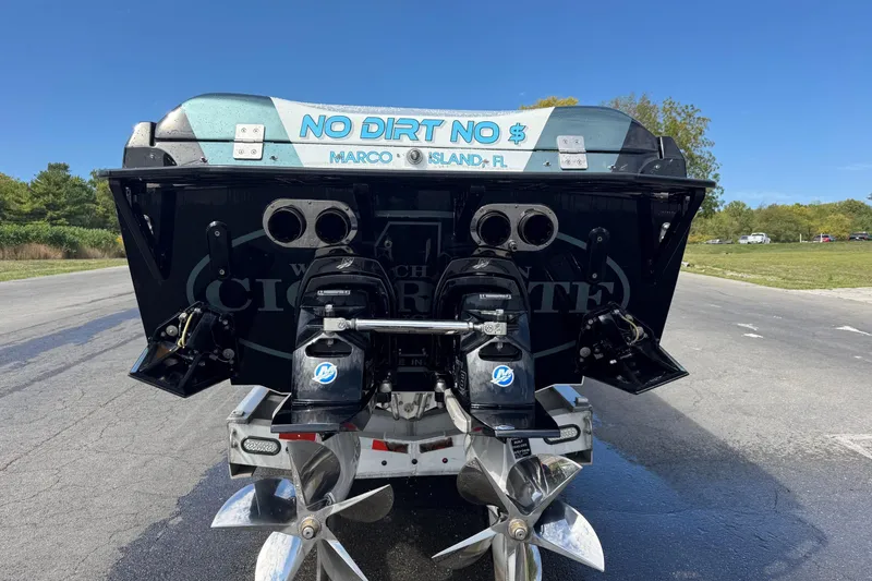 Slide: The Image of Rear view of a 2011 Cigarette 50' Marauder boat with dual engines. - 10