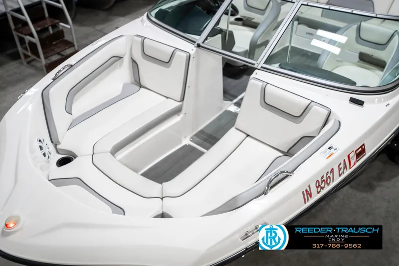 Slide: The Image of 2018 Yamaha Boats SX190 interior with white seating and windshield. - 12