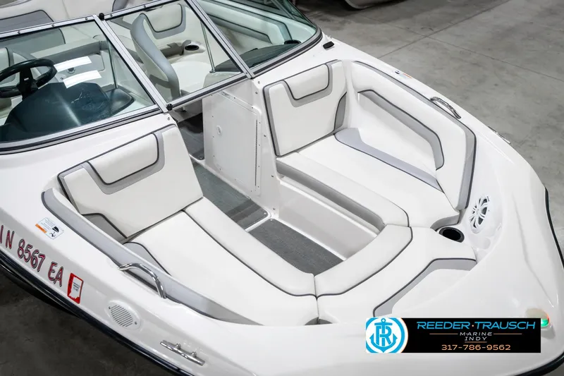 Slide: The Image of 2018 Yamaha Boats SX190 interior with white seating and sleek design. - 13