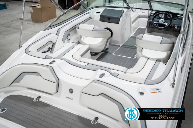 Slide: The Image of 2018 Yamaha SX190 boat interior with sleek seating and modern dashboard design. - 14