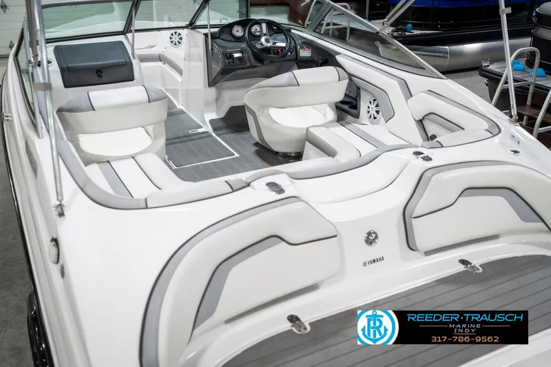 Slide: The Image of 2018 Yamaha Boats SX190 interior with sleek seating and modern dashboard. - 15