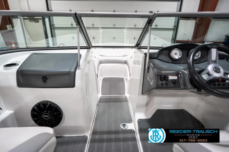 Slide: The Image of 2018 Yamaha Boats SX190 interior with steering wheel and dashboard controls. - 17