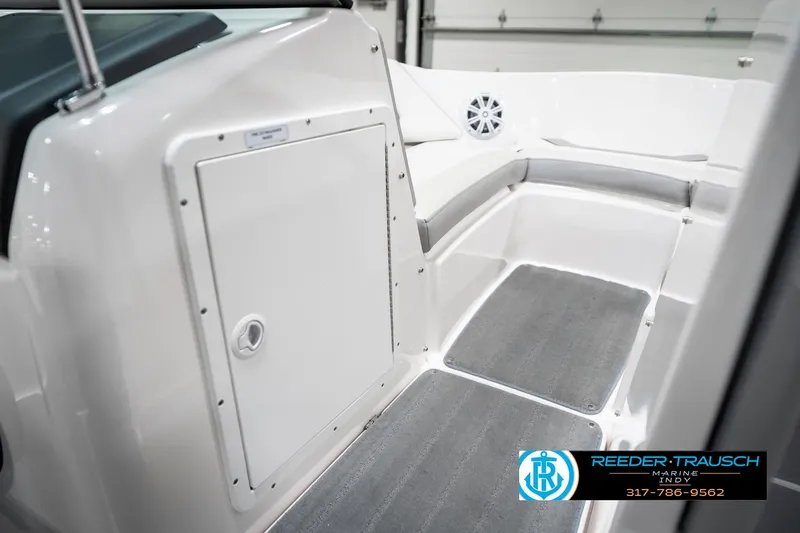 Slide: The Image of 2018 Yamaha Boats SX190 interior with storage compartment and seating area. - 24