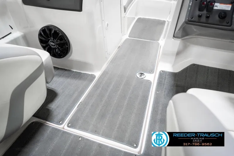 Slide: The Image of 2018 Yamaha SX190 boat interior with gray flooring and speaker. - 26