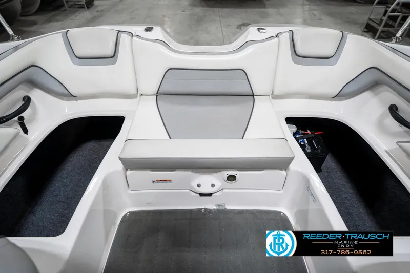 Slide: The Image of 2018 Yamaha Boats SX190 interior seating with gray and white upholstery. - 29