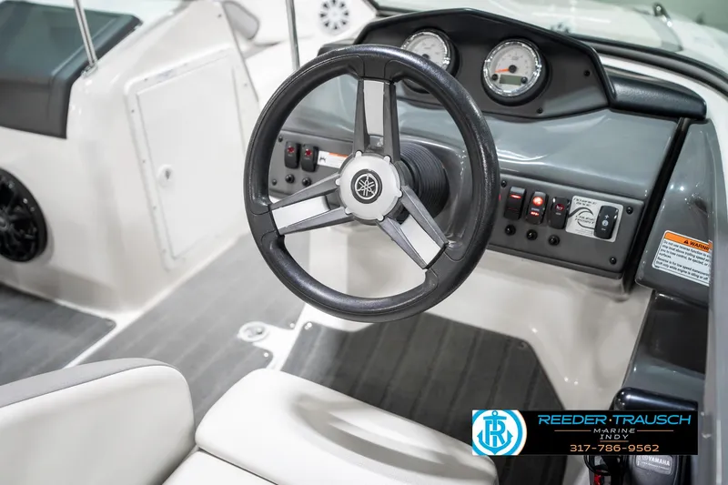 Slide: The Image of 2018 Yamaha SX190 boat dashboard with steering wheel and gauges. - 32