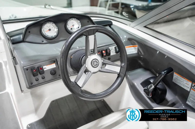 Slide: The Image of 2018 Yamaha SX190 boat dashboard with steering wheel and control panel. - 33