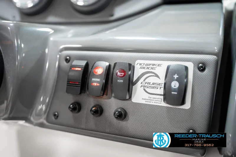 Slide: The Image of Control panel of a 2018 Yamaha Boats SX190 featuring various switches and buttons. - 37