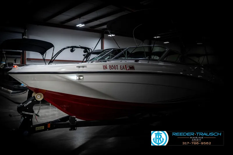Slide: The Image of 2018 Yamaha Boats SX190 in a dimly lit indoor setting. - 4