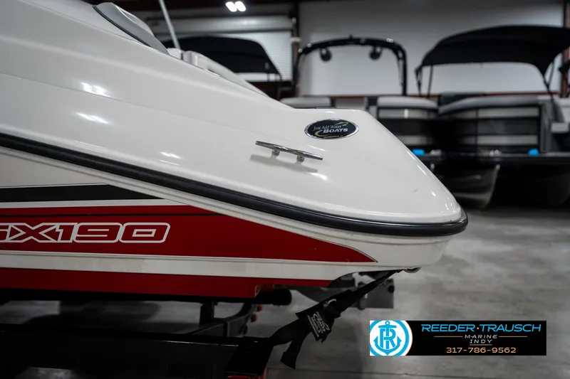 Slide: The Image of 2018 Yamaha Boats SX190 in showroom, featuring sleek red and white design. - 47