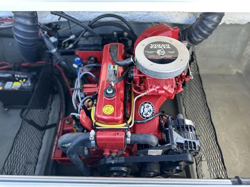 Slide: The Image of 2007 Glastron GT 185 boat engine, featuring a red Volvo Penta motor. - 10
