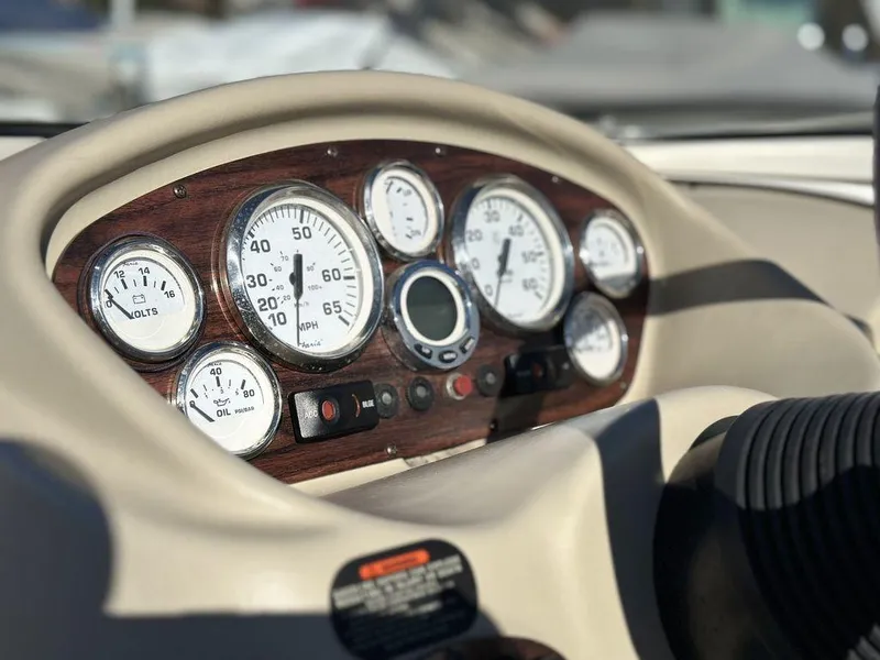 Slide: The Image of Dashboard of 2007 Glastron GT 185 boat with gauges and controls. - 11