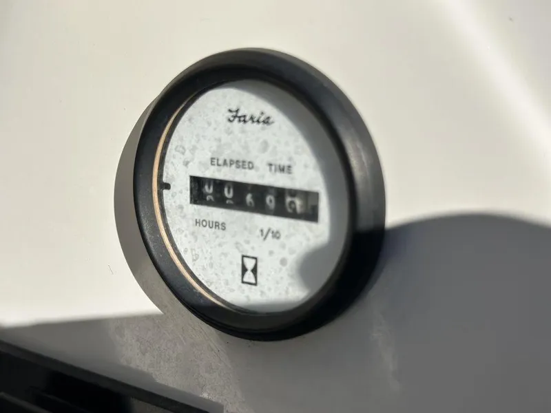 Slide: The Image of Hour meter on 2007 Glastron GT 185 boat, displaying elapsed time in hours. - 13