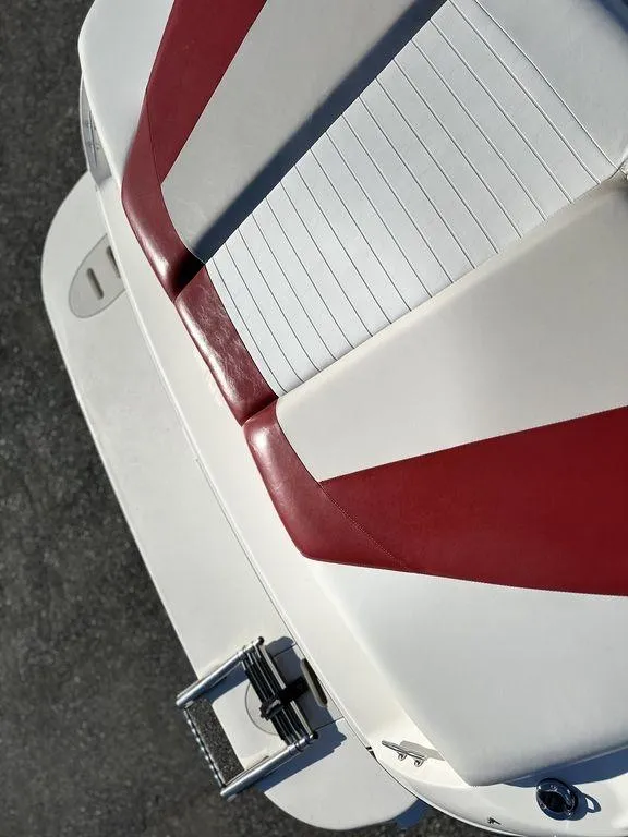 Slide: The Image of 2007 Glastron GT 185 boat with red and white seating, viewed from above. - 15