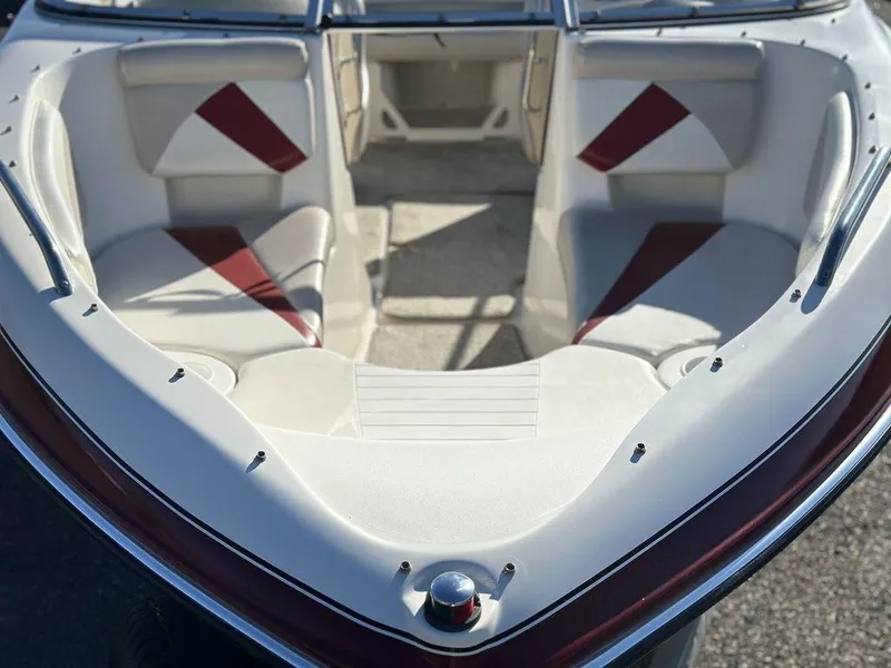Slide: The Image of 2007 Glastron GT 185 boat interior with red and white seating. - 9