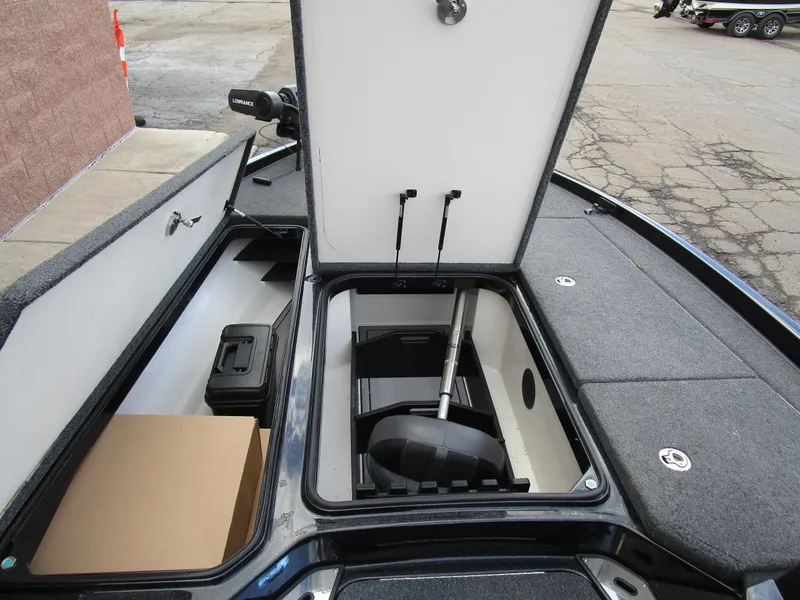 Slide: The Image of 2024 Ranger Z521 Ranger Cup boat storage compartments open, showcasing interior organization. - 11
