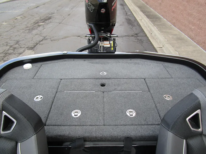 Slide: The Image of 2024 Ranger Z521 Ranger Cup boat deck with motor, featuring sleek seating and storage compartments. - 14