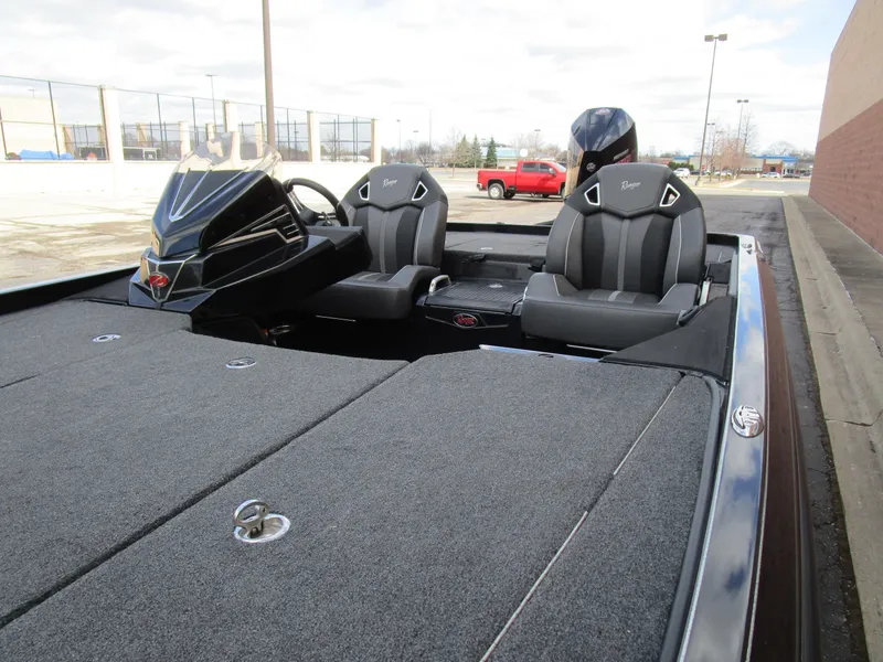Slide: The Image of 2024 Ranger Z521 Ranger Cup boat interior with dual seats and steering console. - 7
