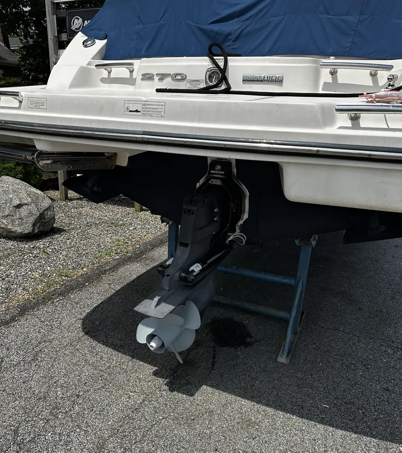 Slide: The Image of 2013 Sea Ray 270 SLX boat stern with covered engine and propeller. - 3