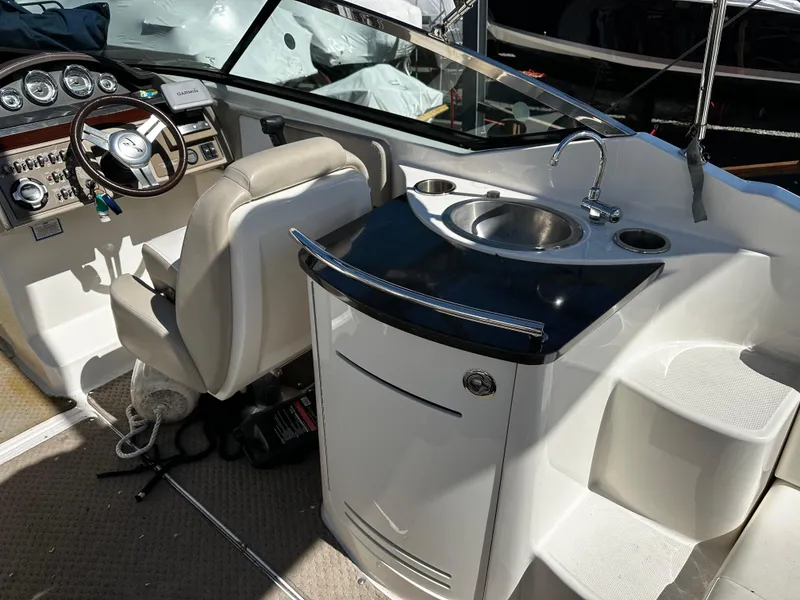 Slide: The Image of Interior of 2013 Sea Ray 270 SLX boat with steering wheel and sink. - 5