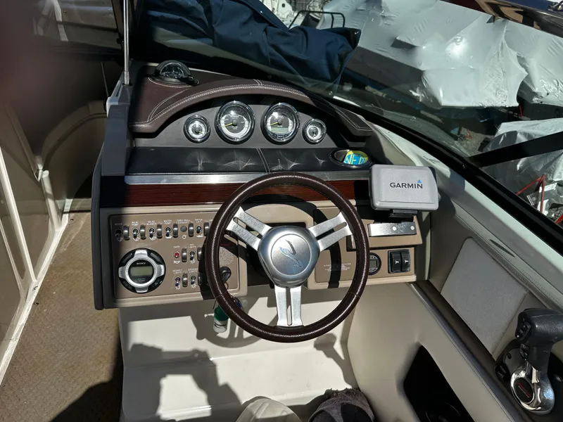 Slide: The Image of 2013 Sea Ray 270 SLX boat dashboard with Garmin navigation system. - 7