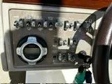 Slide: The Image of Control panel of a 2013 Sea Ray 270 SLX boat with various switches and a stereo system. - 8