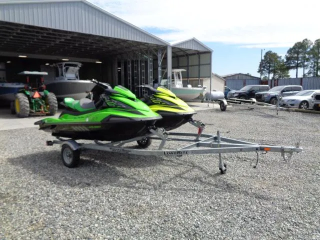 Slide: The Image of 2021 Yamaha WaveRunner VX Cruiser HO jet skis on trailer, parked outside a storage facility. - 12