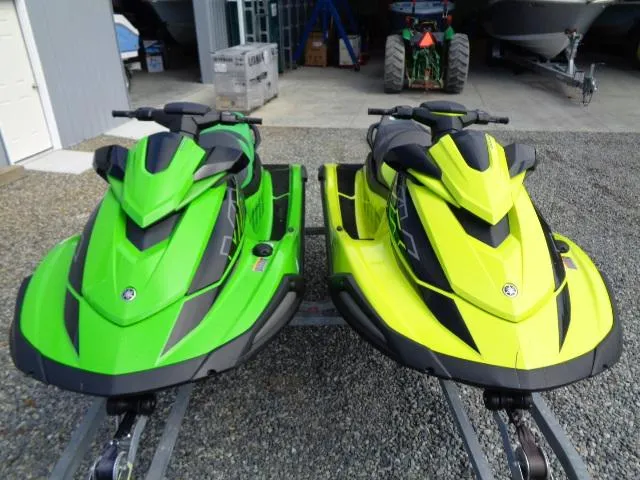 Slide: The Image of Two 2021 Yamaha WaveRunner VX Cruiser HO jet skis in green and yellow. - 16
