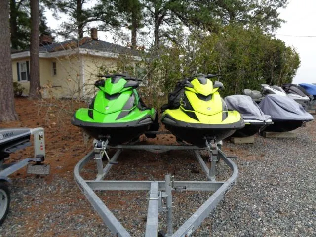 Slide: The Image of 2021 Yamaha WaveRunner VX Cruiser HO jet skis in green and yellow on a trailer. - 19