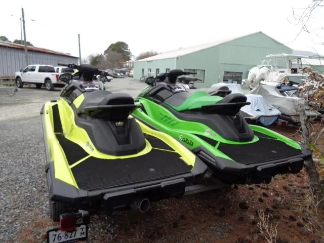 Slide: The Image of Two 2021 Yamaha WaveRunner VX Cruiser HO jet skis parked outdoors. - 21
