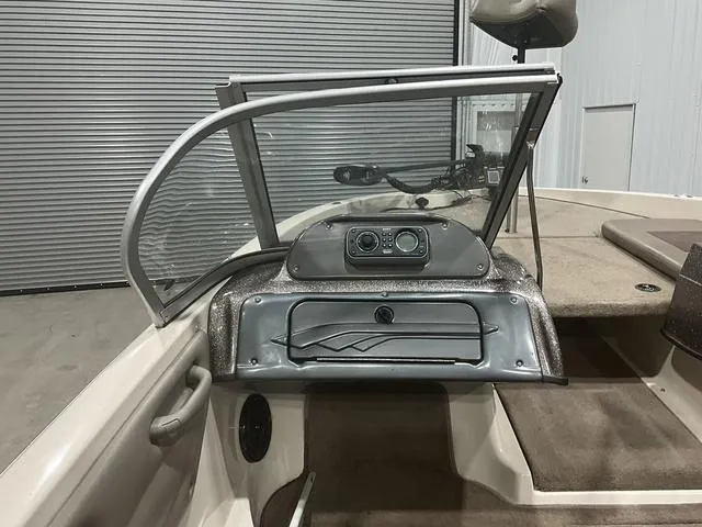 Slide: The Image of 2009 Ranger Reata 186 boat interior with dashboard and seating area. - 13