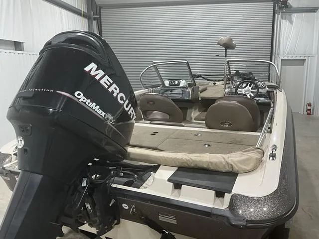 Slide: The Image of 2009 Ranger Reata 186 boat with Mercury OptiMax engine in a garage. - 14