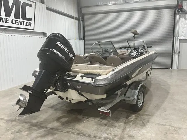 Slide: The Image of 2009 Ranger Reata 186 boat with Mercury outboard motor in a garage setting. - 8