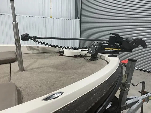 Slide: The Image of 2009 Ranger Reata 186 boat with Minn Kota trolling motor in a garage. - 9