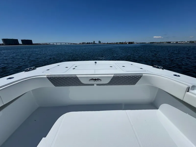 Slide: The Image of 2025 Invincible 40 Catamaran on calm water, showcasing spacious deck and sleek design. - 22